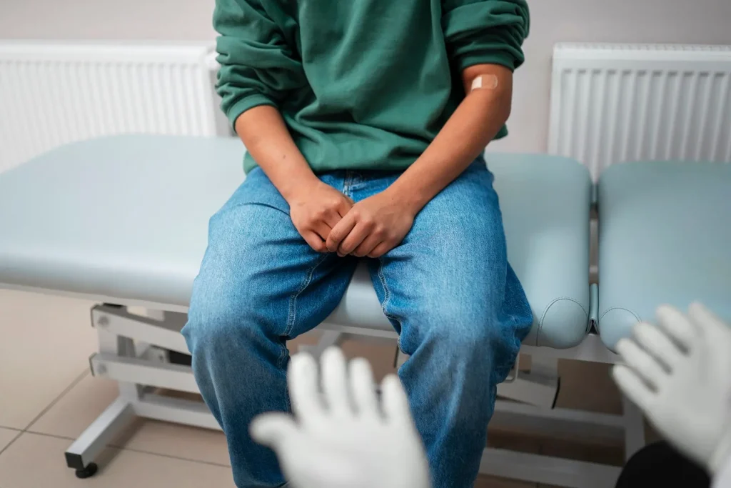 Patient consulting doctor for varicocele symptoms and treatment in Birmingham clinic